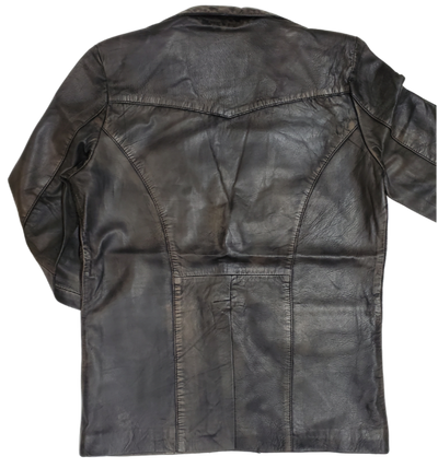 This butter-soft leather blazer jacket for men is delicately distressed in a rich brown hue. Its two pockets are thoughtfully designed for convenient storage, and it is proudly presented in-store at our Smyrna TN shop, located in close proximity to Nashville. Offering  luxury and refinement, this piece is sure to leave an unforgettable impression.