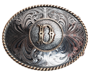 The Initial Western buckle with a scroll background a rope border on a oval shape. Perfect for 1 1/2" Brown or Black belts with it's Antiqued Silver/Brass appearance. Buckle size is approx. 3" x 4" that makes it great for most body styles. Available in our Smyrna, TN shop a short drive from Nashville.