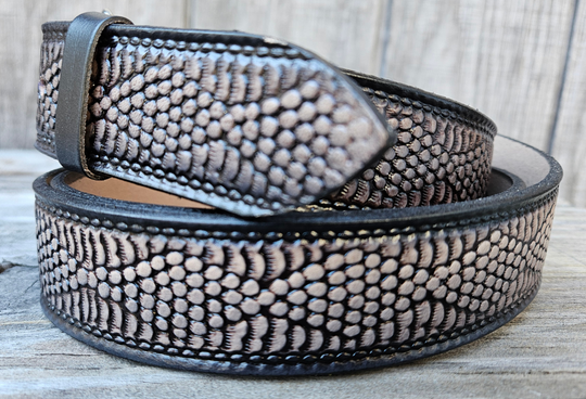 This all leather belt features a Diamondback Rattlesnake pattern in an antiqued finish with a 1 1/2" width. It is crafted from full grain veg-tanned cowhide, with smooth burnished painted edges and a nickel-plated buckle. The buckle can be easily interchanged as well. This product is in stock at our Smyrna, TN shop.