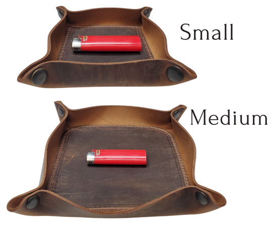 Our Rustic Distressed Leather Valet Tray, crafted in Smyrna, TN, easily folds flat by unsnapping its four Antique Brass snaps—perfect for travel. Its handy 4" x 4" size keeps your everyday essentials like keys and wallet organized. It pairs effortlessly with any style. Colors my vary.

Med. Approx. 8"x 8" (snapped)
Small Approx. 4.5"x 4.5" (snapped)