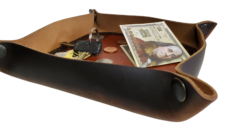 Our Rustic Distressed Leather Valet Tray, crafted in Smyrna, TN, easily folds flat by unsnapping its four Antique Brass snaps—perfect for travel. Its handy 4" x 4" size keeps your everyday essentials like keys and wallet organized. It pairs effortlessly with any style. Colors my vary.

Med. Approx. 8"x 8" (snapped)
Small Approx. 4.5"x 4.5" (snapped)