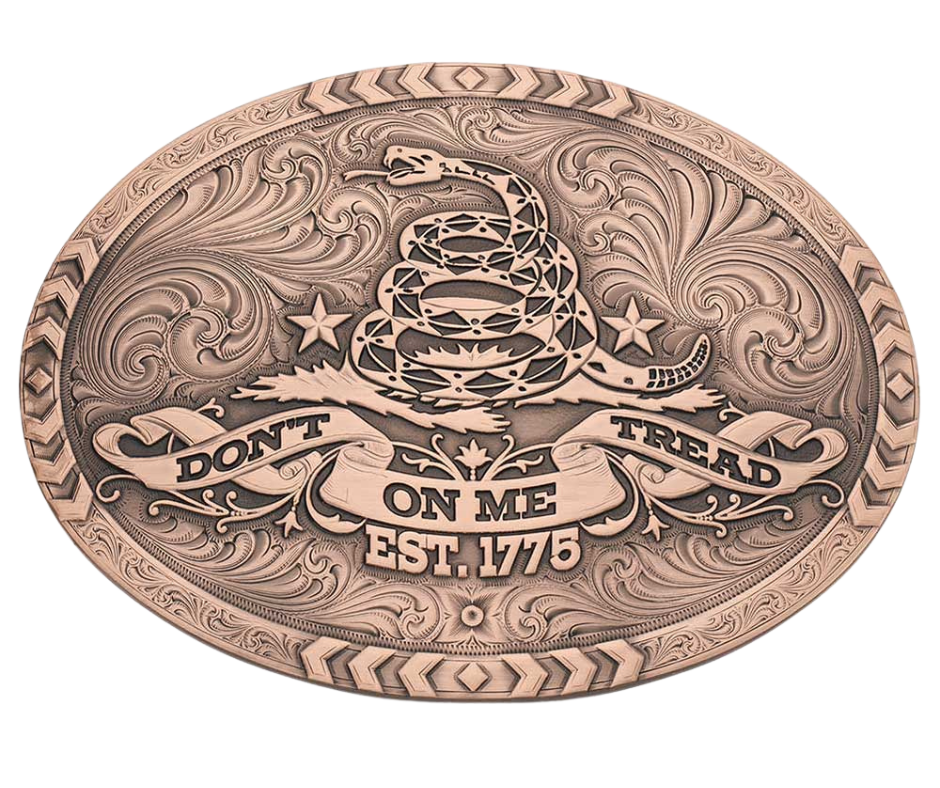 The 1776 Declaration is a Vintage Bronze Gadsden Belt Buckle. This oval buckle features a bronze tone finish. The words "Don’t Tread on Me" are featured prominently on curling ribbon at the bottom of the buckle. The Gadsden rattle snake sits ready to strike in the center of the buckle for a bold look. Chevron designs border the top, bottom, and sides giving the buckle a militant feel. Approx 4"x3" Standard 1.5 inch belt swivel. Get yours at our local Smyrna, TN not far from Nashville.