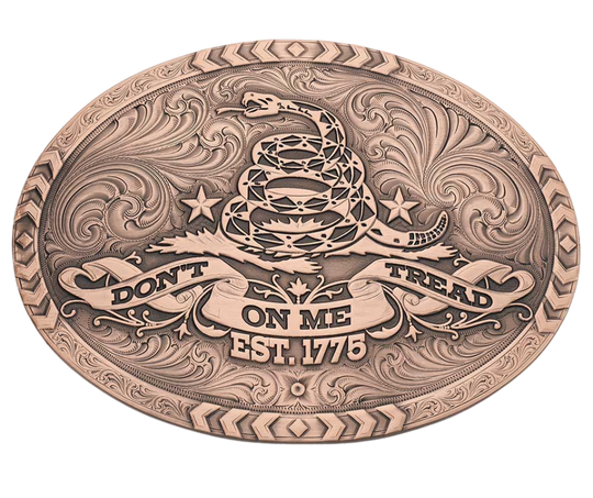 The 1776 Declaration is a Vintage Bronze Gadsden Belt Buckle. This oval buckle features a bronze tone finish. The words "Don’t Tread on Me" are featured prominently on curling ribbon at the bottom of the buckle. The Gadsden rattle snake sits ready to strike in the center of the buckle for a bold look. Chevron designs border the top, bottom, and sides giving the buckle a militant feel. Approx 4"x3" Standard 1.5 inch belt swivel. Get yours at our local Smyrna, TN not far from Nashville.