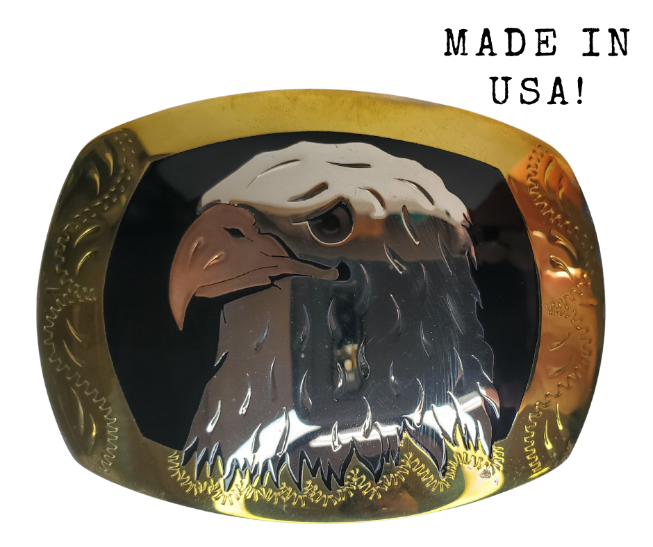 The Bald Eagle a symbol of the USA where this buckle is made! Handmade of German silver, a copper Eagle beak with a black resin inlay background and brass border.  rectangular buckle with a 2 3/4 x 3 “ size.  Available in our Smyrna TN shop just outside of Nashville.