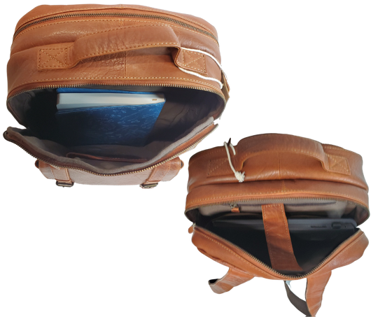 The Educator, a sturdy Leather backpack is available at our Smyrna, TN shop not far from Nashville. It has one front zip pocket, a front pouch that closes by a flap with clasps
accented with decorative adjustable straps. A forward main compartment that zips closed and contains a narrow inside open pocket for glasses, pencils, or phone, and is topped with a leather handle.