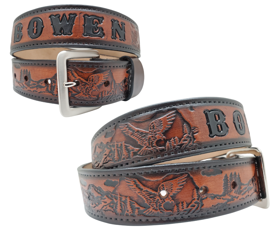 Get ready for an unforgettable climb to the top with The "Eagle Mountain" Name Belt! This one-of-a-kind belt features a 1 1/2" width and is hand-stained with a strip of vegetable tanned leather. The bold design includes a embossed Stitch border and Eagle center pattern, while the solid brass buckle in antique nickel finish adds a touch of ruggedness. Handcrafted at our shop in Smyrna, Tennessee, just outside Nashville.