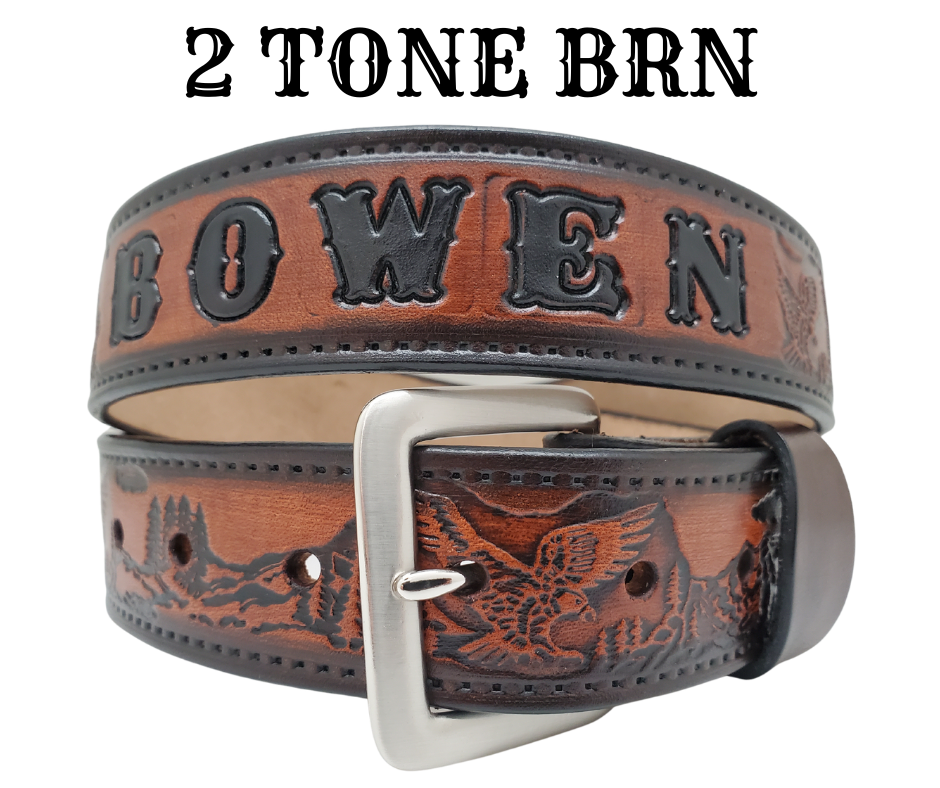Get ready for an unforgettable climb to the top with The "Eagle Mountain" Name Belt! This one-of-a-kind belt features a 1 1/2" width and is hand-stained with a strip of vegetable tanned leather. The bold design includes a embossed Stitch border and Eagle center pattern, while the solid brass buckle in antique nickel finish adds a touch of ruggedness. Handcrafted at our shop in Smyrna, Tennessee, just outside Nashville.