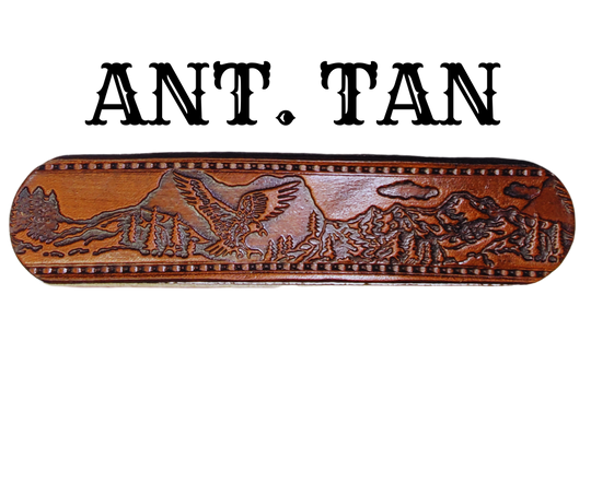 Get ready for an unforgettable climb to the top with The "Eagle Mountain" Name Belt! This one-of-a-kind belt features a 1 1/2" width and is hand-stained with a strip of vegetable tanned leather. The bold design includes a embossed Stitch border and Eagle center pattern, while the solid brass buckle in antique nickel finish adds a touch of ruggedness. Handcrafted at our shop in Smyrna, Tennessee, just outside Nashville.