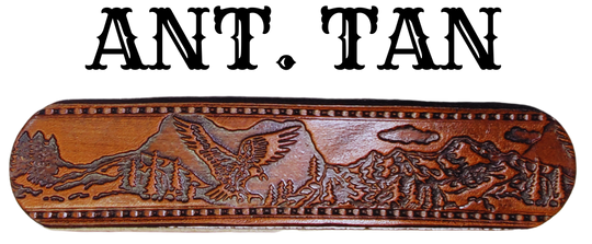 Get ready for an unforgettable climb to the top with The "Eagle Mountain" Name Belt! This one-of-a-kind belt features a 1 1/2" width and is hand-stained with a strip of vegetable tanned leather. The bold design includes a embossed Stitch border and Eagle center pattern, while the solid brass buckle in antique nickel finish adds a touch of ruggedness. Handcrafted at our shop in Smyrna, Tennessee, just outside Nashville.