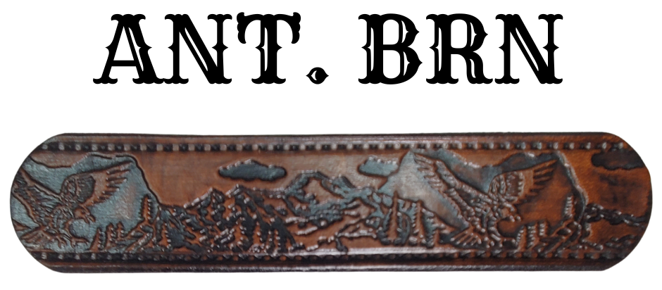Get ready for an unforgettable climb to the top with The "Eagle Mountain" Name Belt! This one-of-a-kind belt features a 1 1/2" width and is hand-stained with a strip of vegetable tanned leather. The bold design includes a embossed Stitch border and Eagle center pattern, while the solid brass buckle in antique nickel finish adds a touch of ruggedness. Handcrafted at our shop in Smyrna, Tennessee, just outside Nashville.