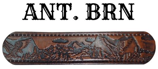 Get ready for an unforgettable climb to the top with The "Eagle Mountain" Name Belt! This one-of-a-kind belt features a 1 1/2" width and is hand-stained with a strip of vegetable tanned leather. The bold design includes a embossed Stitch border and Eagle center pattern, while the solid brass buckle in antique nickel finish adds a touch of ruggedness. Handcrafted at our shop in Smyrna, Tennessee, just outside Nashville.