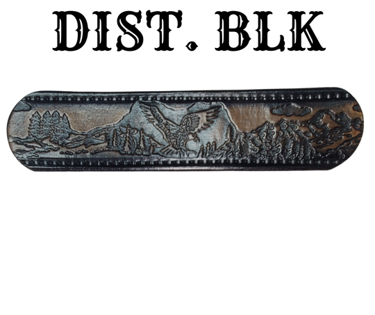 Get ready for an unforgettable climb to the top with The "Eagle Mountain" Name Belt! This one-of-a-kind belt features a 1 1/2" width and is hand-stained with a strip of vegetable tanned leather. The bold design includes a embossed Stitch border and Eagle center pattern, while the solid brass buckle in antique nickel finish adds a touch of ruggedness. Handcrafted at our shop in Smyrna, Tennessee, just outside Nashville.
