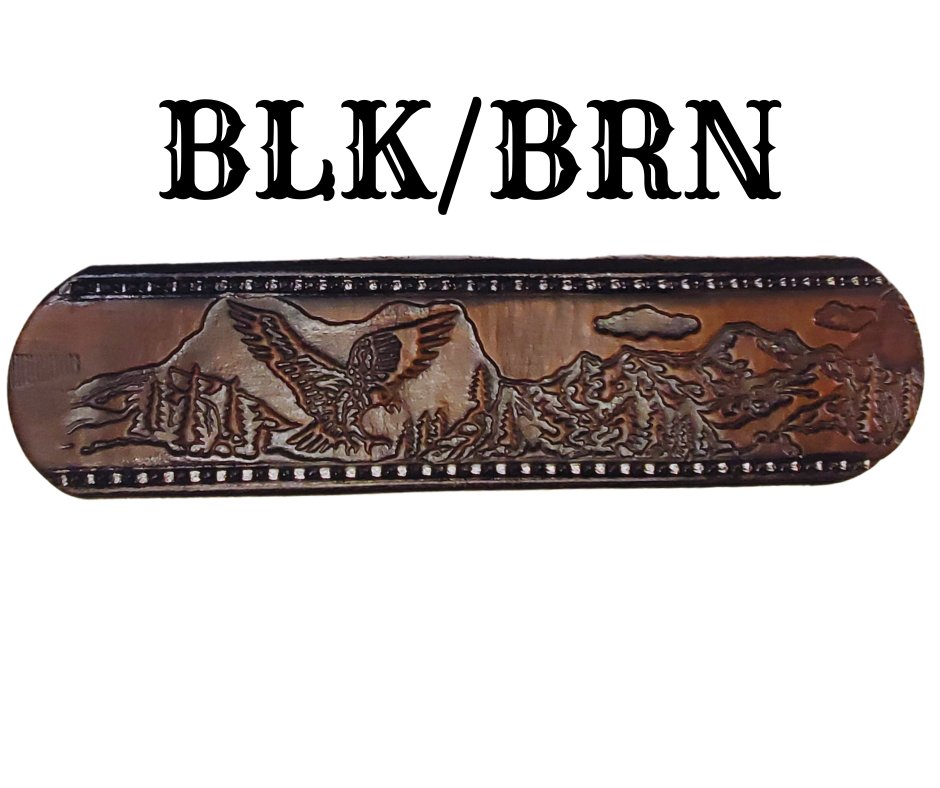 Get ready for an unforgettable climb to the top with The "Eagle Mountain" Name Belt! This one-of-a-kind belt features a 1 1/2" width and is hand-stained with a strip of vegetable tanned leather. The bold design includes a embossed Stitch border and Eagle center pattern, while the solid brass buckle in antique nickel finish adds a touch of ruggedness. Handcrafted at our shop in Smyrna, Tennessee, just outside Nashville.