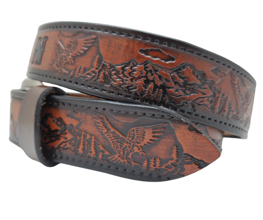 Get ready for an unforgettable climb to the top with The "Eagle Mountain" Name Belt! This one-of-a-kind belt features a 1 1/2" width and is hand-stained with a strip of vegetable tanned leather. The bold design includes a embossed Stitch border and Eagle center pattern, while the solid brass buckle in antique nickel finish adds a touch of ruggedness. Handcrafted at our shop in Smyrna, Tennessee, just outside Nashville.