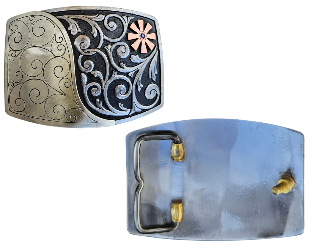 The Endless Breeze Belt Buckle has a more contemporary design accented with multi Scrolls divided into right and left colors and a Copper colored cog wheel on the top right. Made from German Silver and engraved and layered metals in a tri-color design. Available in our Smyrna, TN shop, a short distance from Nashville.

Dimensions: Width 4”, Height 2.7”
Standard 1.5” Swivel