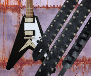 Metal and Leather have been staple for years in Rock music and accessories!  "This 2" wide Guitar Strap is a nod to that classic influence. It's made from 1/8" thick Classic Black Pebble Grain Cowhide and after some gig's it'll look like you bought in a Vintage shop. The classic adjustment style goes from approx. 42" to 56" at it's longest . Made just outside Nashville in our Smyrna, TN. shop. It will need a bit of time to "break in" but will get a great patina over time. 