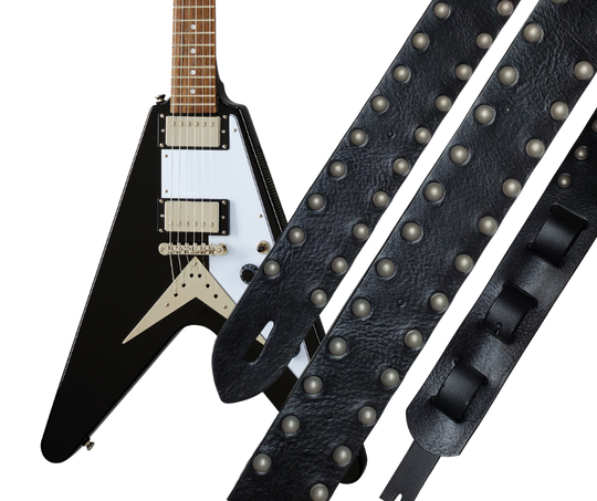Metal and Leather have been staple for years in Rock music and accessories!  "This 2" wide Guitar Strap is a nod to that classic influence. It's made from 1/8" thick Classic Black Pebble Grain Cowhide and after some gig's it'll look like you bought in a Vintage shop. The classic adjustment style goes from approx. 42" to 56" at it's longest . Made just outside Nashville in our Smyrna, TN. shop. It will need a bit of time to "break in" but will get a great patina over time. 