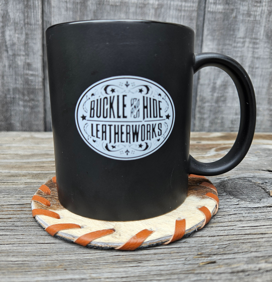 Authentic hair-on cowhide with stitched trim. Approx. 4.5" diameter. Shipped in assorted patterns and Western-themed motifs. Perfect for those rustic western themed event. Made in India. Now available in our local Smyrna, TN shop.