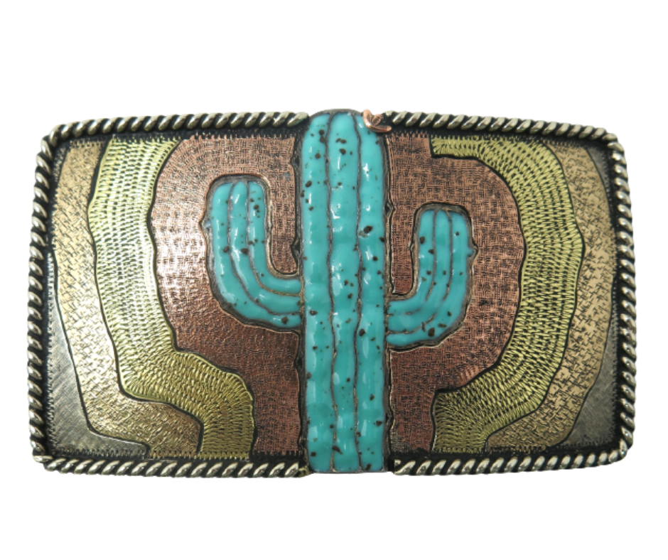 The El Cacto buckle is made from German Silver (nickel and brass alloy) or iron metal base. Each piece is punched, cut, soldered, engraved, polished and painted by our talented metal workers. In order to give you the quality and long lasting final product we also plate each piece with copper, nickel and silver to ensure the piece's long lasting qualities. Available at our Smyrna, TN shop just outside of Nashville.

Approx. Width 4” Height 3”
Standard 1.5” width belt