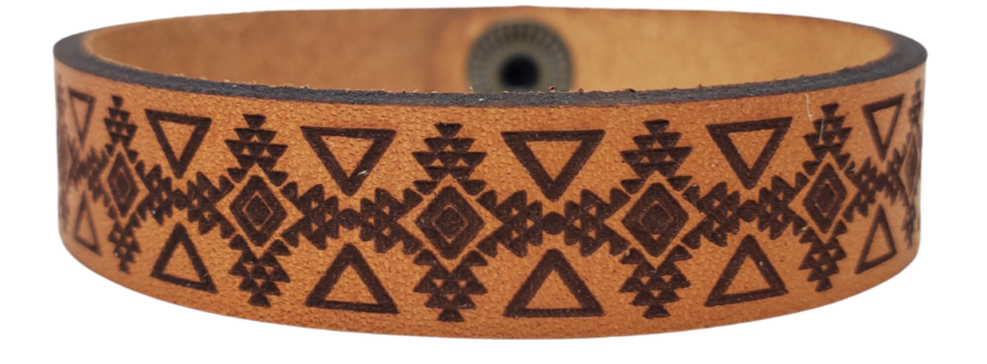 Assorted Southwestern style bracelet cuffs are made from laser engraved, premium, full grain leather, and finished with solid brass snap for a long lasting touch. It's comfortable and lightweight, making it great for everyday wear. 7 1/2 x 1/2 in. Stocked at our Smyrna, TN shop. 