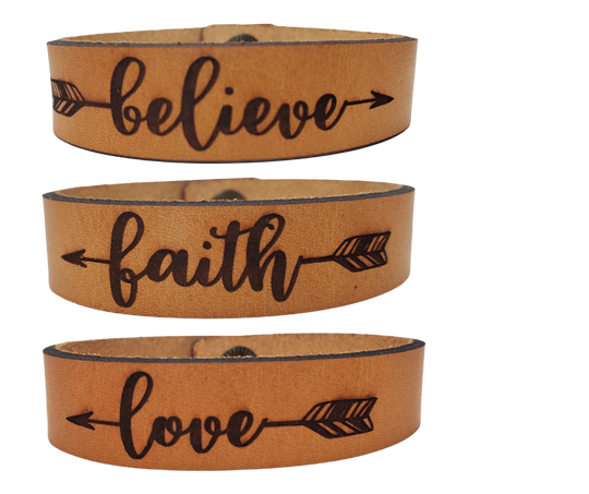 Inspiring Leather Bracelets Stocked at our Smyrna, TN shop. Believe, Faith, &amp; Love bracelet cuffs are made from laser engraved, premium, full grain leather, and finished with solid brass snap for a long lasting touch. It's comfortable and lightweight, making it great for everyday wear. 7 1/2 x 1/2 in