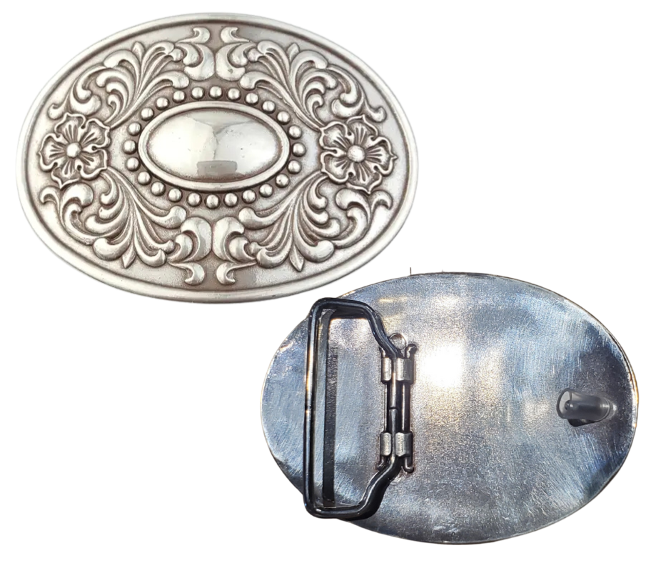 The "Victorian" buckle features an oval design adorned with western-style flowers framing a beaded oval center that resembles a rustic, unpolished mirror. It fits a standard 1 1/2" belt and measures about 2 1/2" by 3 3/4". Finished in antique silver, this charming buckle is ready to add a touch of vintage flair. Grab yours online or visit us in Smyrna, TN, just a stone’s throw from Nashville!