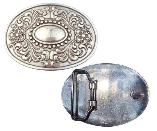 The "Victorian" buckle features an oval design adorned with western-style flowers framing a beaded oval center that resembles a rustic, unpolished mirror. It fits a standard 1 1/2" belt and measures about 2 1/2" by 3 3/4". Finished in antique silver, this charming buckle is ready to add a touch of vintage flair. Grab yours online or visit us in Smyrna, TN, just a stone’s throw from Nashville!