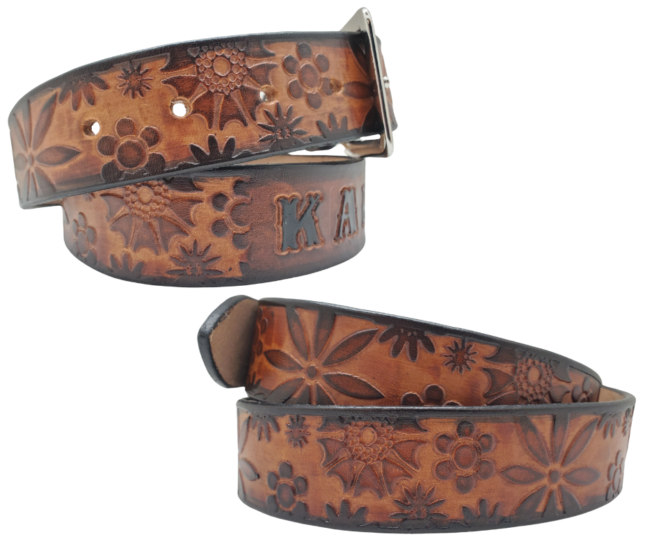 Our salute to Peace and Love "The Flower Child" is a handmade real leather belt made from a single strip of cowhide shoulder leather that is 8-10 oz. or approx. 1/8" thick. It has hand burnished (smoothed) & edges and summer flowers embossed in 3 color options. The antique nickel plated solid brass buckle is snapped in place with heavy snaps. This belt is made just outside Nashville in Smyrna, TN.