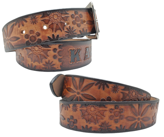 Our salute to Peace and Love "The Flower Child" is a handmade real leather belt made from a single strip of cowhide shoulder leather that is 8-10 oz. or approx. 1/8" thick. It has hand burnished (smoothed) & edges and summer flowers embossed in 3 color options. The antique nickel plated solid brass buckle is snapped in place with heavy snaps. This belt is made just outside Nashville in Smyrna, TN.