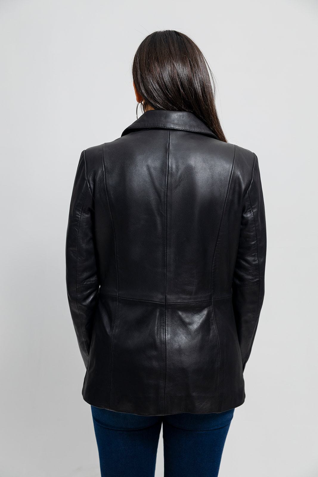 The Dahlia is a classic mid length two button blazer that gives any outfit a sleek and polished look. Available in black. Lambskin leather. Classic fit. Fully lined. One chest pocket. Two hand pockets. Button detail on sleeves. You can find it near Nashville, in Smyrna, TN.

Sizes XS-5XL Call for size availability.