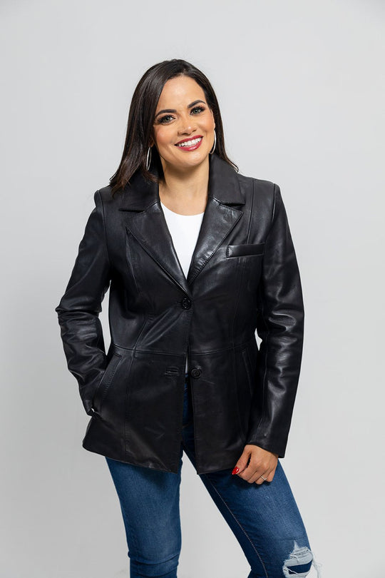 The Dahlia is a classic mid length two button blazer that gives any outfit a sleek and polished look. Available in black. Lambskin leather. Classic fit. Fully lined. One chest pocket. Two hand pockets. Button detail on sleeves. You can find it near Nashville, in Smyrna, TN.

Sizes XS-5XL Call for size availability.