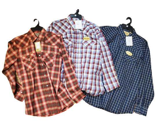 It doesn't get much anymore classic than a plaid pearl snap western shirt. Complete with two front flap pockets, pearl snap details in the vintage plaid pattern. These never go out of style, always a in style! Available in our Smyrna, TN shop just outside Nashville. Imported

Note: the Plaid colors Blue, Red, and Brown, or Black will always be the base color BUT the tones may change occasionally. The yokes ,snaps will be the same as well.

Details: Snaps, 2 Pockets, Yokes
