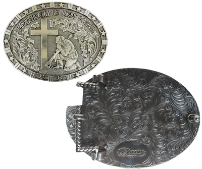 This oval-shaped buckle from Nocona showcases that our nation's veterans will never be forgotten. With its patriotic stars around the edge and Western scrollwork, plus the depiction of a Soldier kneeling at a Cross, it serves as a beautiful reminder. Roughly 2 3/4" tall and 3 3/4" wide, it's designed to fit belts up to 1 1/2" wide. Pick up your own at our retail store in Smyrna, TN (just outside Nashville) or shop online! Imported.