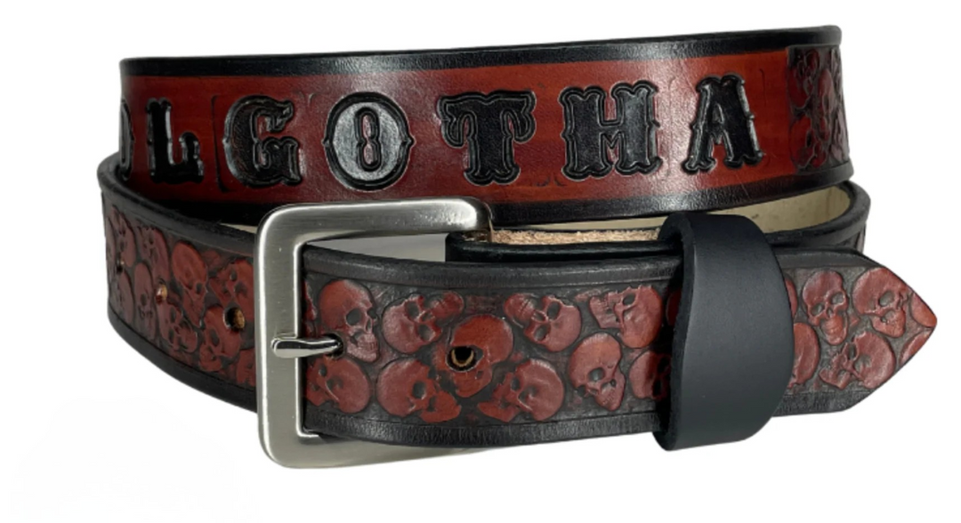"The Forsaken" is a handmade real leather belt made from a single strip of cowhide shoulder leather that is 8-10 oz. or approx. 1/8" thick. It has hand burnished (smoothed) edges and the Skull pattern embossed on the surface. The antique nickel plated solid brass buckle is snapped in place with heavy snaps. This belt is made just outside Nashville in Smyrna, TN. 