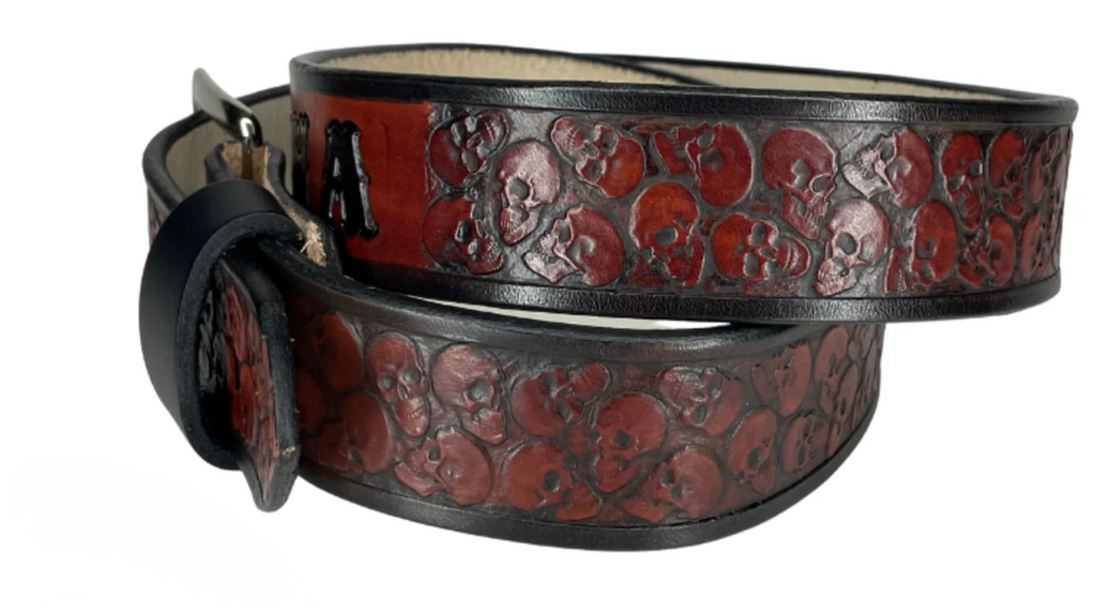 "The Forsaken" is a handmade real leather belt made from a single strip of cowhide shoulder leather that is 8-10 oz. or approx. 1/8" thick. It has hand burnished (smoothed) edges and the Skull pattern embossed on the surface. The antique nickel plated solid brass buckle is snapped in place with heavy snaps. This belt is made just outside Nashville in Smyrna, TN. 