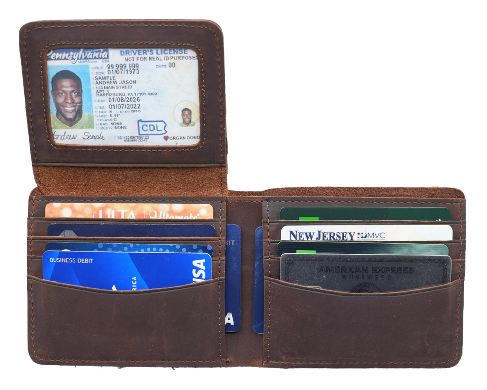 Our USA Made Garrison Leather Wallet for Men. Made slim which isn't easy to do for a real leather wallet. Has all the slots for the cards you need for your daily use. Plus it has RFID for protection from scammers. Now in stock at our Smyrna, TN shop not far from the Gulch area in Nashville.

With Flap Out ID Window Holder
Handcrafted, Strong Stitching
Extra Capacity for bills
14 Card Slots
Gift for Him