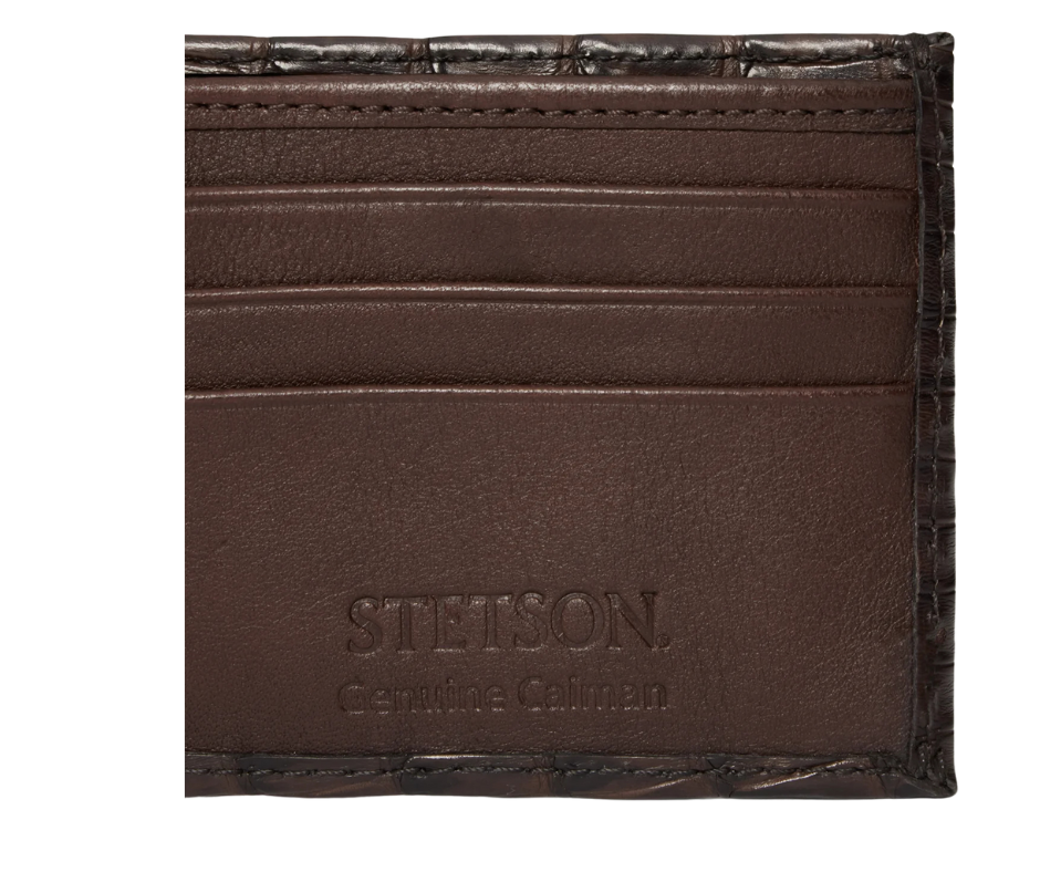 Made from authentic Classic Black or Cigar Brown Caiman leather, this bi-fold wallet blends classic western flair with luxurious materials that turn heads. True to Stetson’s legendary dedication to quality and craftsmanship, it offers 6 card slots, 2 hidden pockets underneath, and a spacious cash compartment. Available now at our Smyrna, TN store, just a short drive from downtown Nashville. Proudly made in Mexico.