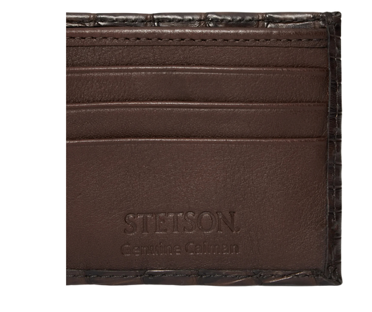 Made from authentic Classic Black or Cigar Brown Caiman leather, this bi-fold wallet blends classic western flair with luxurious materials that turn heads. True to Stetson’s legendary dedication to quality and craftsmanship, it offers 6 card slots, 2 hidden pockets underneath, and a spacious cash compartment. Available now at our Smyrna, TN store, just a short drive from downtown Nashville. Proudly made in Mexico.