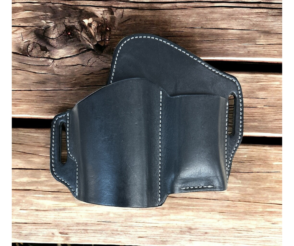The Leather Belt Holster is a popular choice for everyday carry. Crafted with all leather and a slots for belt attachment, this holster also offers a slot for a magazine. See them at our local shop in Smyrna, TN. Choose Black or Brown and fit belts up to 1 3/4" width.