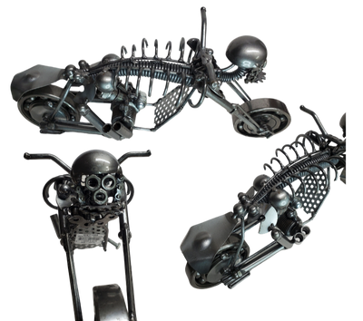 The perfect addition to your Man Cave! This metal art piece is a unique gift for any motorcycle enthusiast. Featuring nuts, bolts, springs, and bearing wheels, it also has a skull in place of a headlight. Need more details? Take a look at the picture for dimensions. This is our biggest piece in stock, and you can find it at our store in Smyrna, conveniently located just outside Nashville, TN.