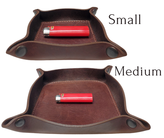 Make it PERSONAL! This handmade real leather valet tray can be personalized with up to 8-10 letters. It has Antique Brass SNAPPED corners to FLATTEN out for easy packing for travel. It is made in our Smyrna, TN shop just outside Nashville. It is a perfect catch-all for keeping keys and other small items in one place at the end of a long day. Makes a great gift for groomsmen, or that special someone.

Med. Approx. 7"x 7" (snapped)
Small Approx. 4.5"x 4.5" (snapped)