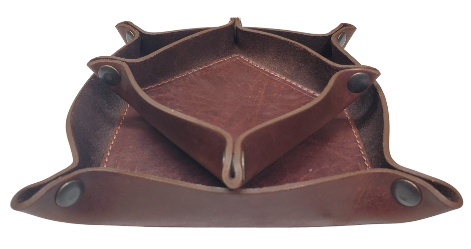 Make it PERSONAL! This handmade real leather valet tray can be personalized with up to 8-10 letters. It has Antique Brass SNAPPED corners to FLATTEN out for easy packing for travel. It is made in our Smyrna, TN shop just outside Nashville. It is a perfect catch-all for keeping keys and other small items in one place at the end of a long day. Makes a great gift for groomsmen, or that special someone.

Med. Approx. 7"x 7" (snapped)
Small Approx. 4.5"x 4.5" (snapped)