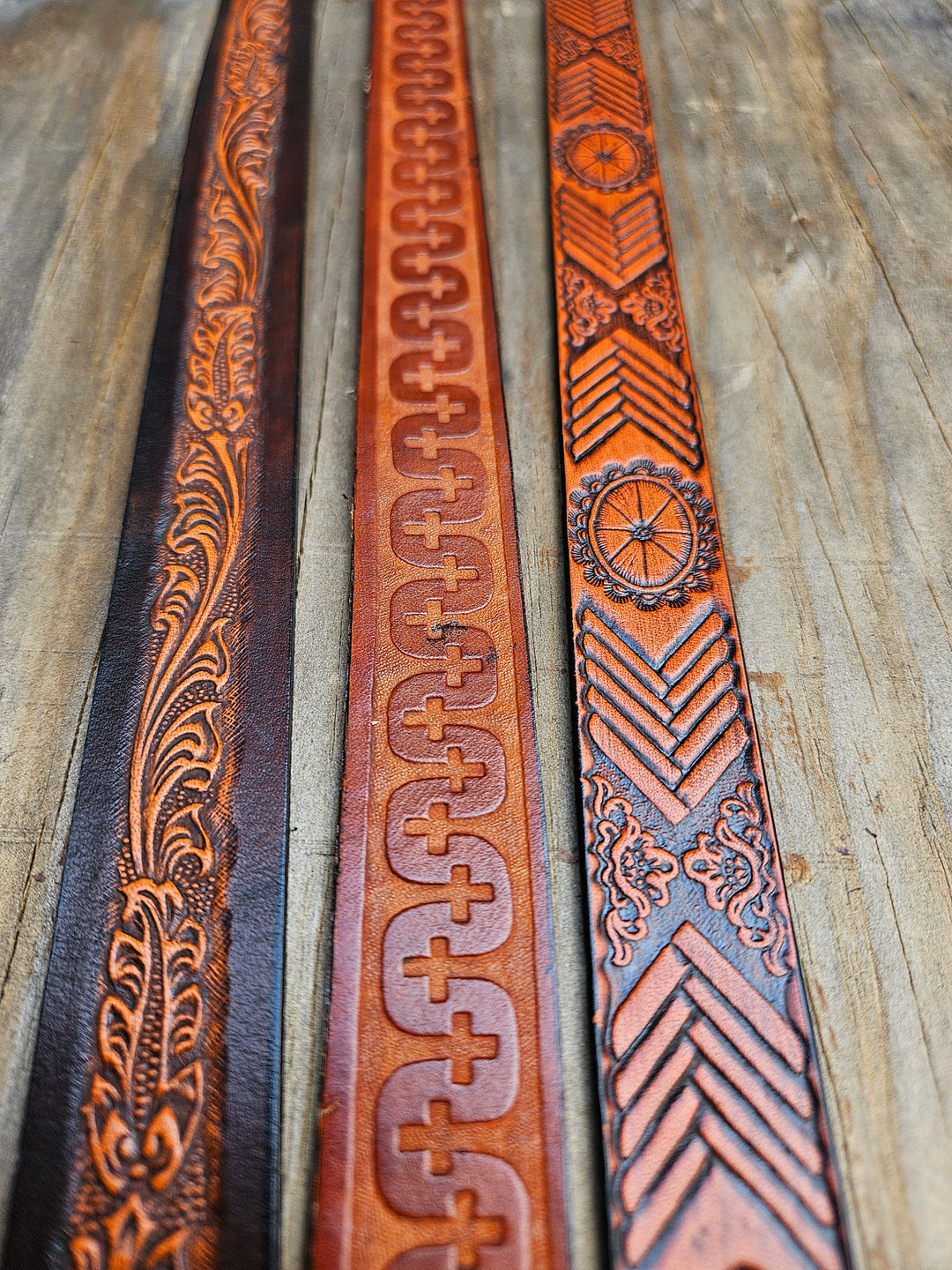 Classic Western Styled, embossed pattern leather hatbands that are 3/4"/1" wide fitting up to size 7 1/2 hat.&nbsp; Fit's most any hat with adjustable bead and leather 1/8" string. Will fit most WESTERN crowned hats. Made in our Smyrna, TN. shop a short drive from downtown Nashville, TN.

These are random hatbands made in store and we put them in a 3 packs at a Discounted price. See the others
23" long (without tie string)
NO subs.&nbsp;