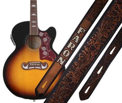 This Guitar Strap is crafted to the same high quality as our Custom belts! It's made of 1/8" thick, vegetable-tanned cowhide, with beveled and black painted edges, and a unique hand stained finish and a Hand Painted Name. The main strap is one 1 1/2" wide, with a single hole in the front and 3-hole adjustment on the back. We proudly manufacture it in Smyrna, TN - just outside Nashville. 