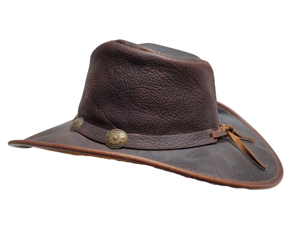 Experience the classic Australian hat style with our "Walker" Leather Hat. Crafted from high-quality Full Grain Leather, this hat features a 3" Shapeable Brim and a modest crown height. Adding a touch of flair is a Tieback Concho Band. Visit our Smyrna, TN shop, conveniently located a short drive from downtown Nashville, choose from sizes S-XL.&nbsp;