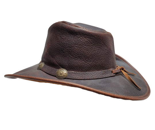 Experience the classic Australian hat style with our "Walker" Leather Hat. Crafted from high-quality Full Grain Leather, this hat features a 3" Shapeable Brim and a modest crown height. Adding a touch of flair is a Tieback Concho Band. Visit our Smyrna, TN shop, conveniently located a short drive from downtown Nashville, choose from sizes S-XL.&nbsp;