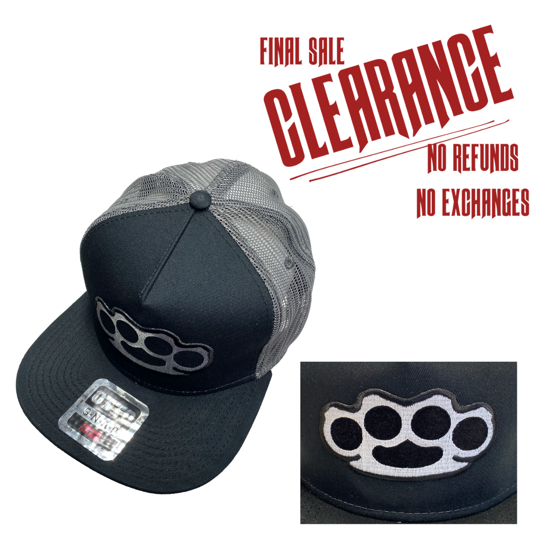 Black&nbsp;Flat Bill Cap with Gray mesh back. Front has a Silver&nbsp;embroidered Brass Knuckles patch. "HARDCORE"&nbsp;design also under the bill. Structured top to keep its shape. Sold at our shop just outside Nashville in Smyrna, TN.