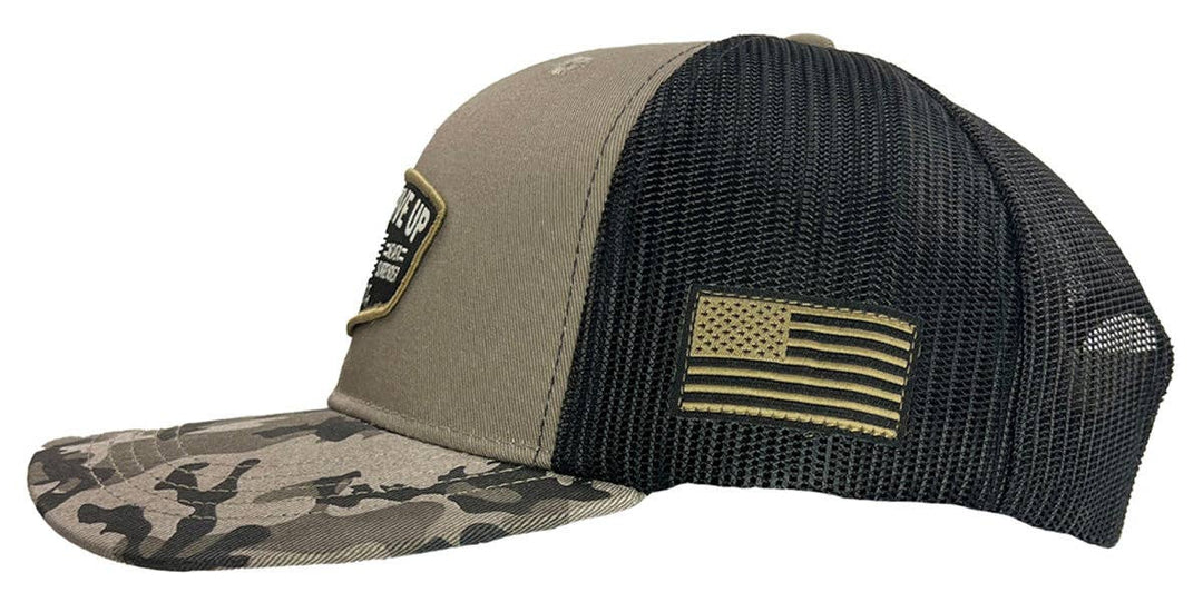 Hold Fast and Stand your ground in this rugged “Never Give Up” Cap by Kerusso. Be prepared to stand up for who and what you believe in. Love of God, love of family, and love for your country. We sell these at our Smyrna, TN shop because we BELIEVE too!

Color: Black/Gray Camo * 100% Polyester
Mid-Rise structured * Polyester front with woven label scout patch
Mesh back with snap closure * Do not launder.
One size fits most
