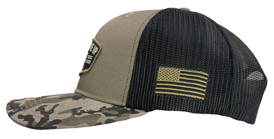 Hold Fast and Stand your ground in this rugged “Never Give Up” Cap by Kerusso. Be prepared to stand up for who and what you believe in. Love of God, love of family, and love for your country. We sell these at our Smyrna, TN shop because we BELIEVE too!

Color: Black/Gray Camo * 100% Polyester
Mid-Rise structured * Polyester front with woven label scout patch
Mesh back with snap closure * Do not launder.
One size fits most
