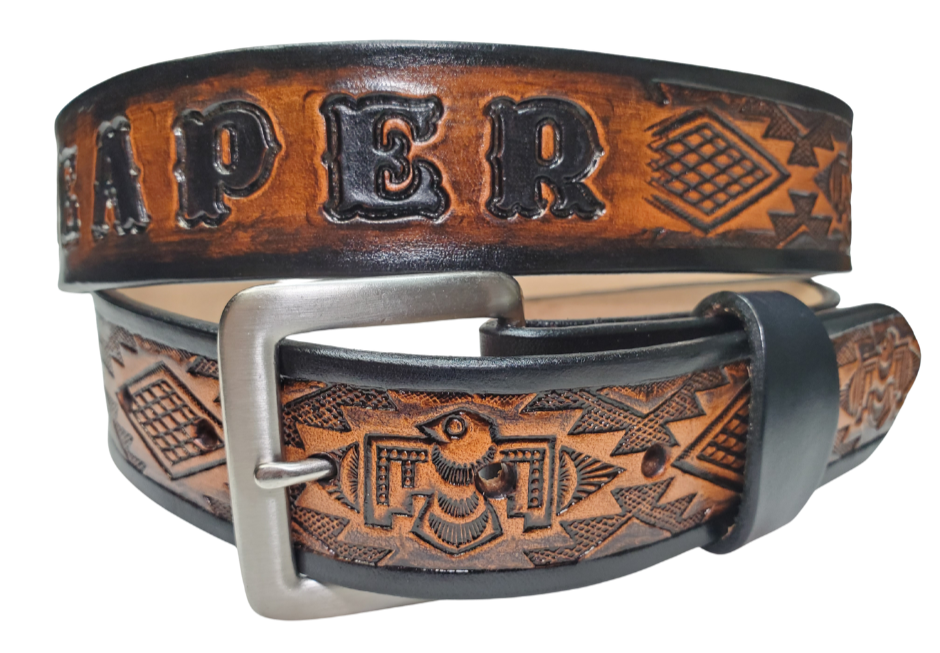 The Holliday features a cool Southwestern embossing on its full-grain American veg-tanned cowhide, about 1/8" thick and 1 1/2" wide. It sports a solid brass buckle with an antique nickel finish, available in 3 hand-finished colors and smooth, burnished painted edges. You can personalize it with your name or let the design run wild across the whole belt. Crafted with care in our Smyrna, TN workshop just outside Nashville.